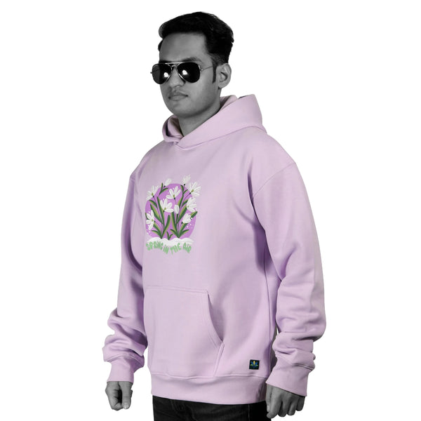 model  wearing an oversized branded lavender hoodies